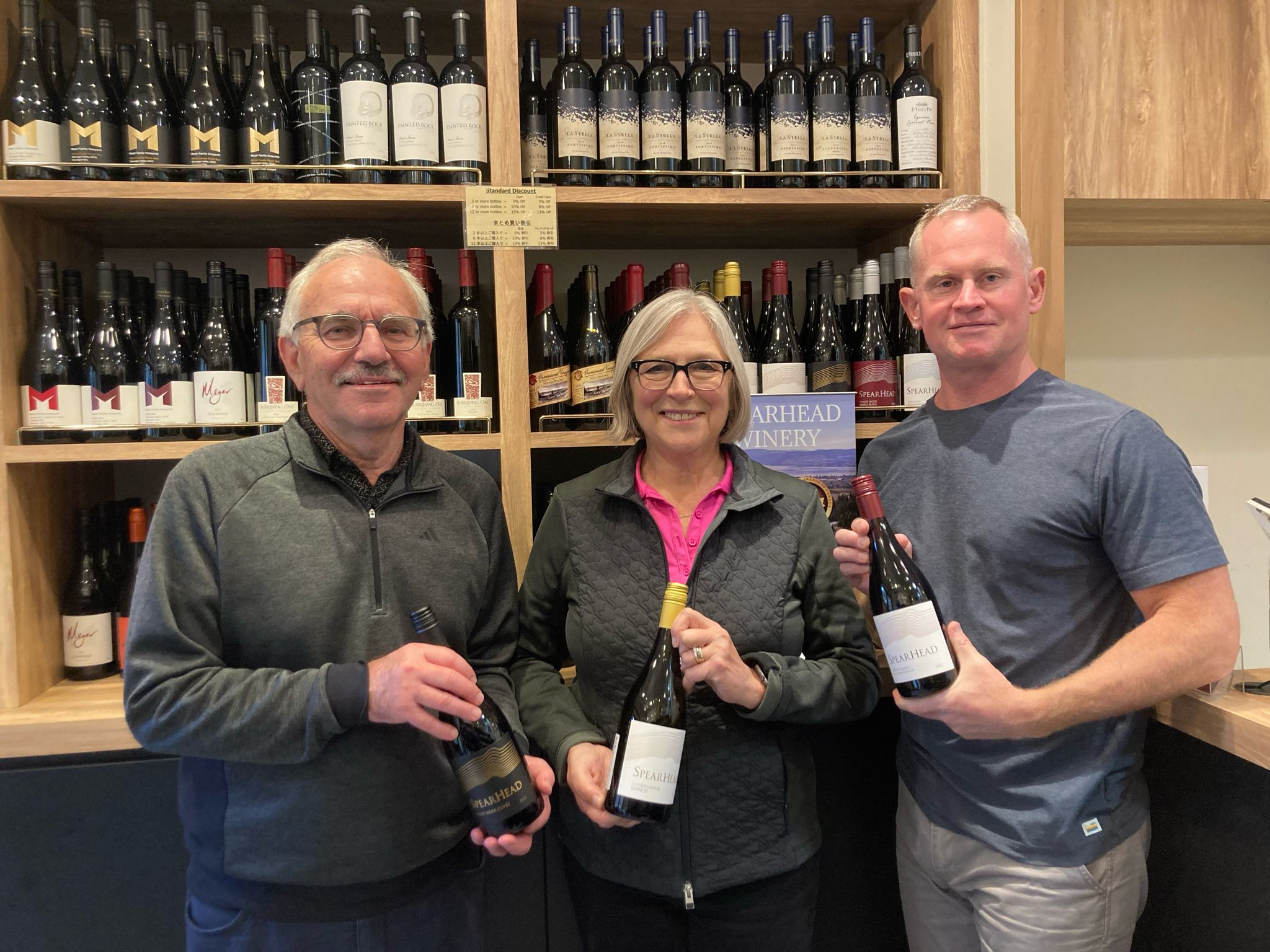 Jamie Paquin with the owners of Spearhead Winery at Heavenly Vines in Ebisu